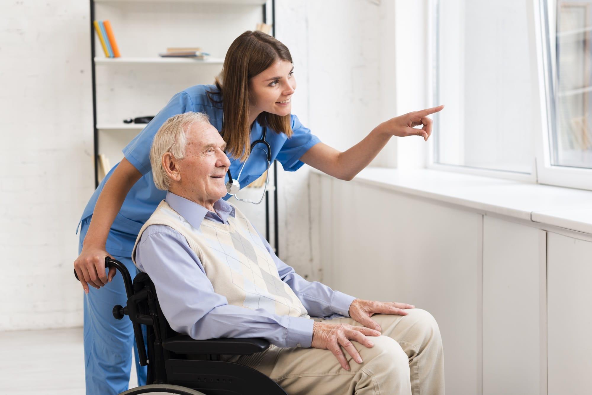 Nurse pointing at window while talking to older man